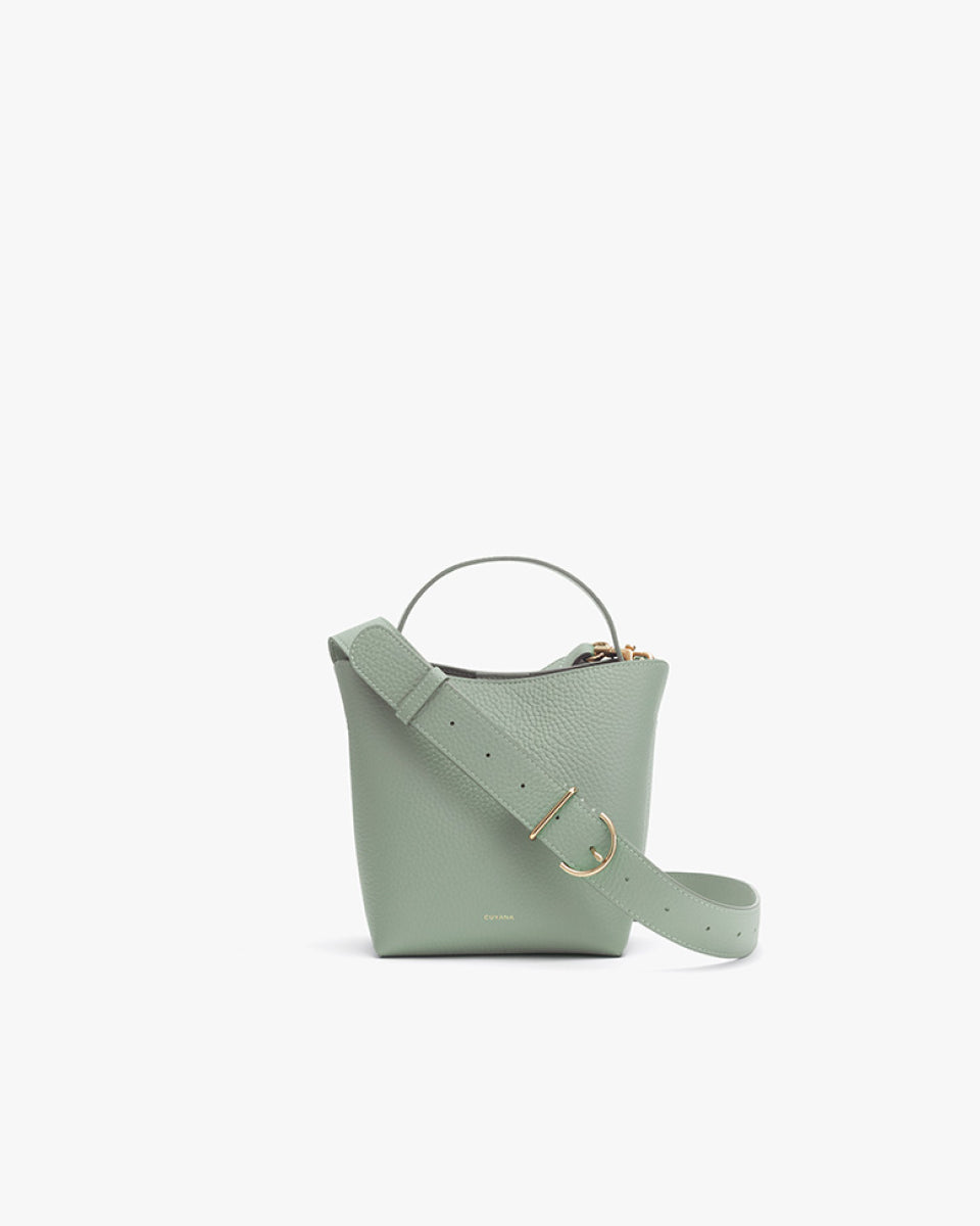 Handbag with a top handle and an adjustable shoulder strap