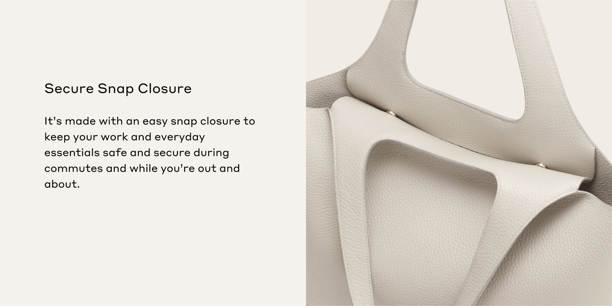 Close-up of a bag's snap closure and handle.