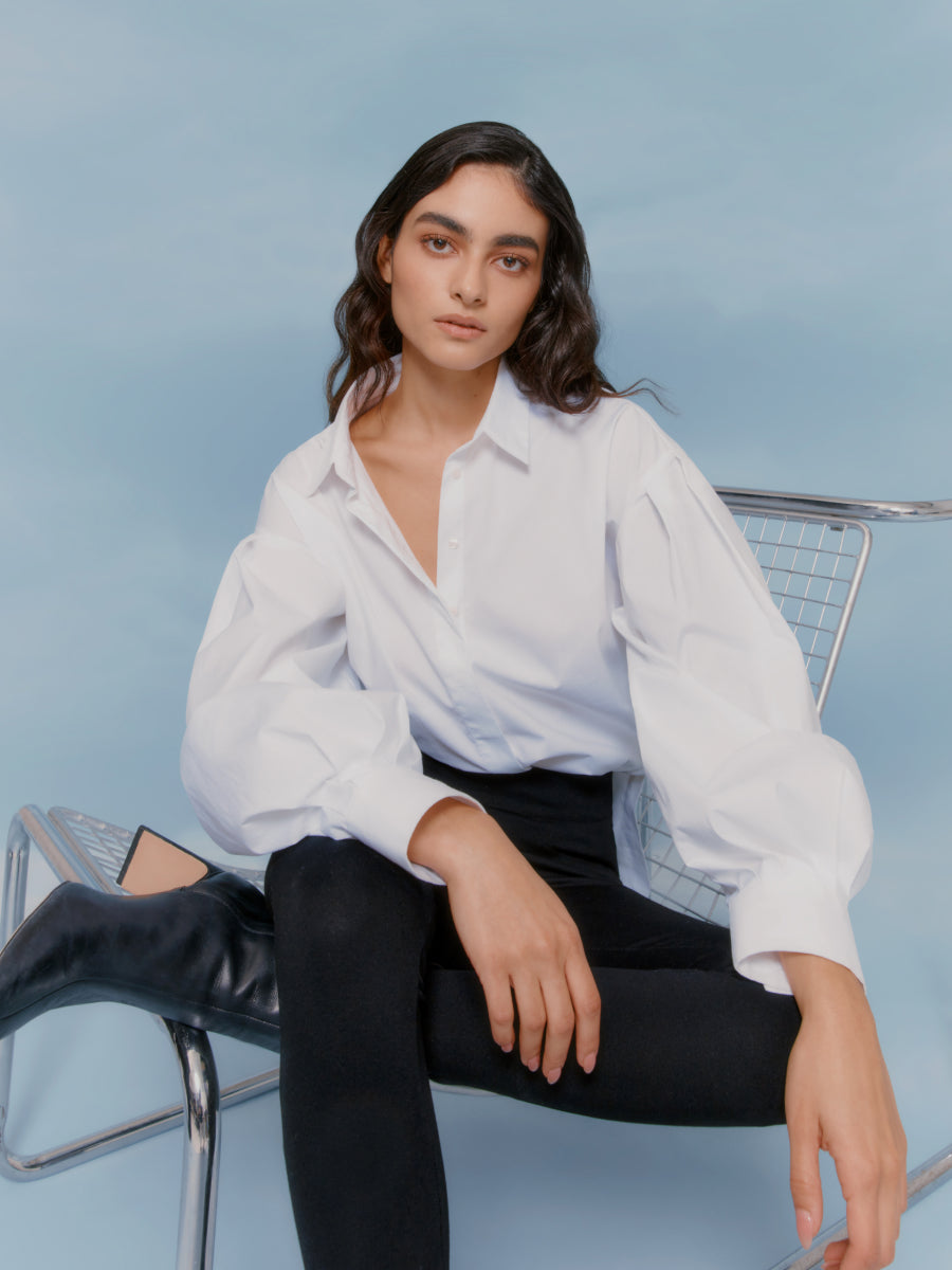 Person seated on a chair looking at the camera