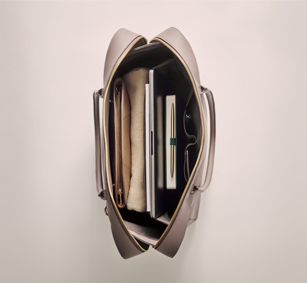 Open travel bag with organized items inside.