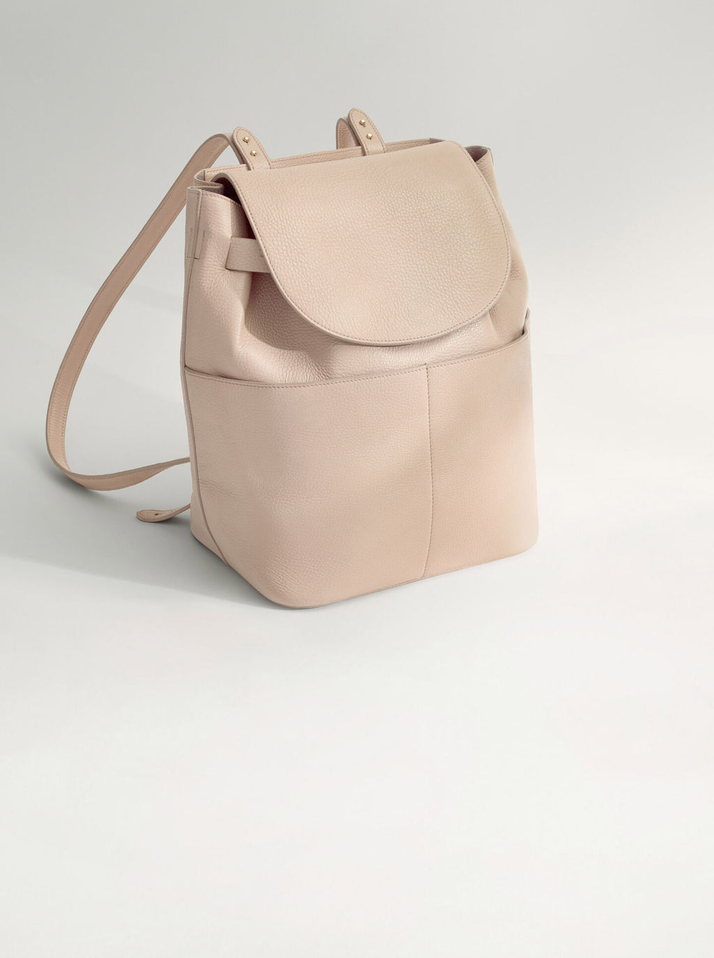 Backpack standing upright on a plain background.