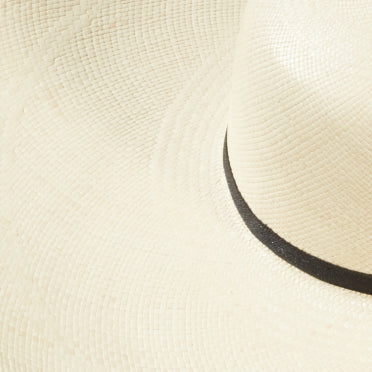 Close-up of a hat with a curved brim.