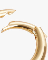 Close-up of a broken circular metal bracelet.