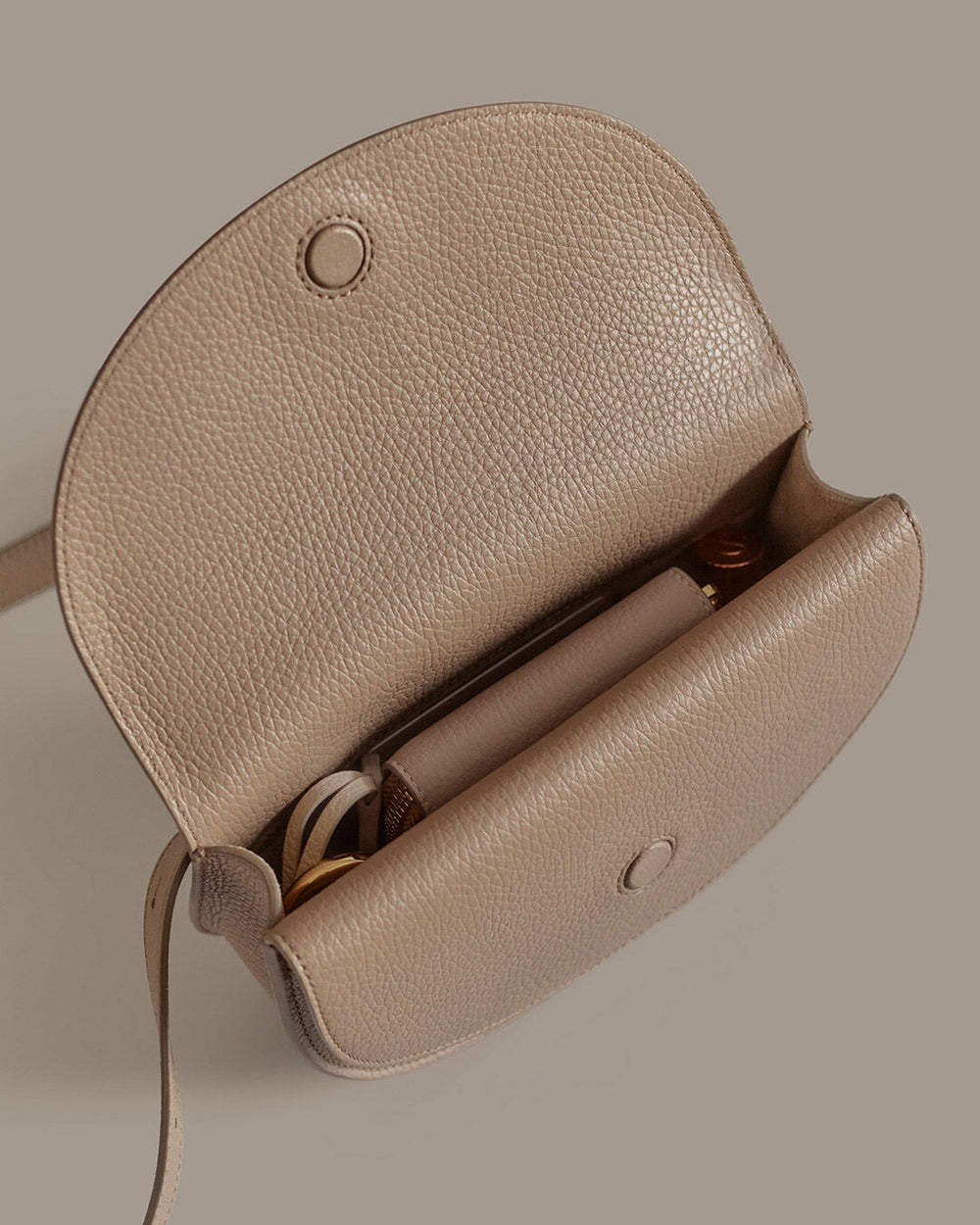 Open handbag with visible contents inside.