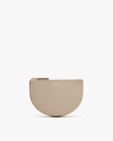 Round zippered pouch with personalized initials on front.