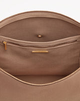 Open bag showing interior compartments and zippers.