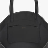 Top view of a handbag with two handles and a front pocket.