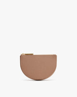 Small half-moon shaped zippered pouch standing upright.