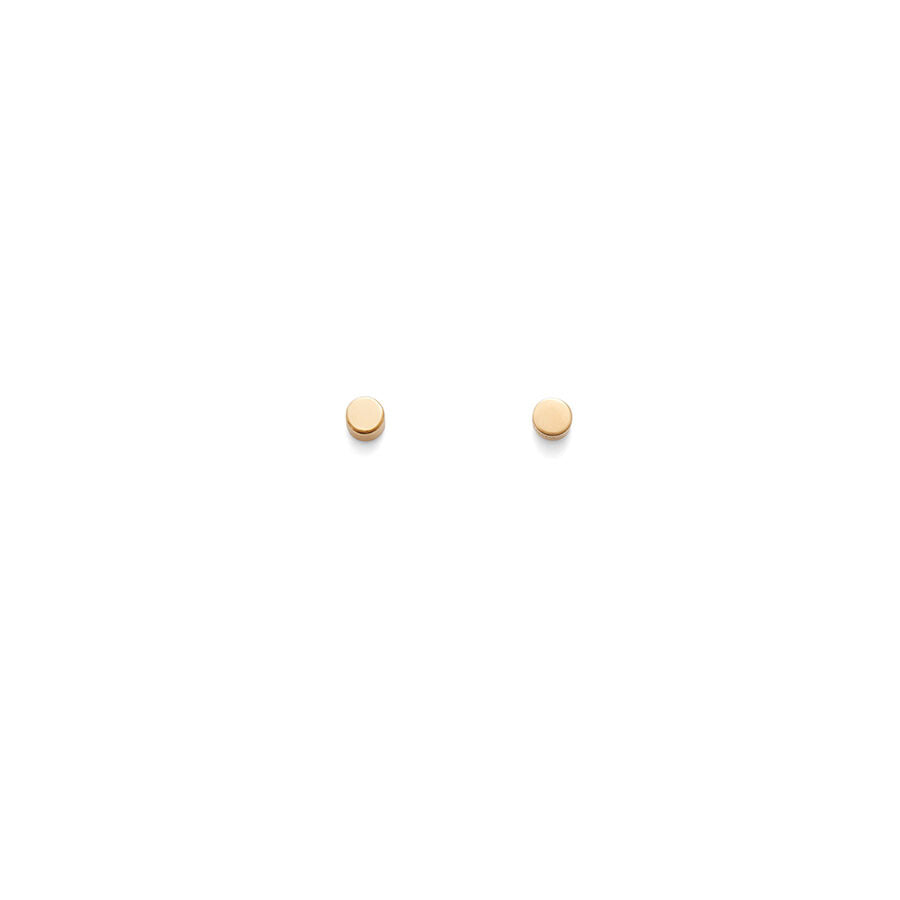Two round objects placed apart on a plain surface.