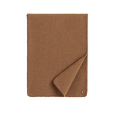 Closed fabric notebook with one corner folded open.
